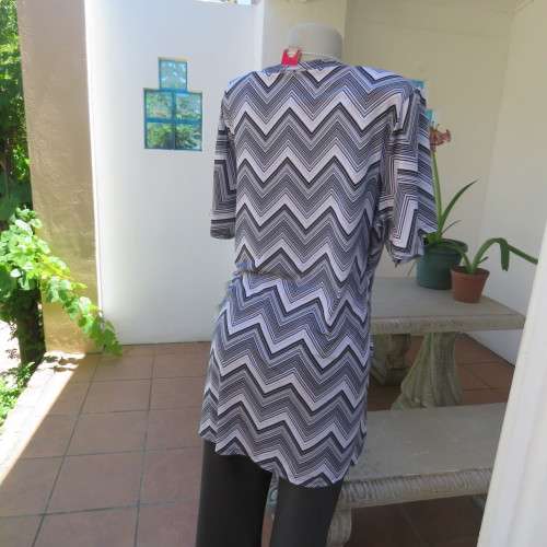 Stunning cross-over long white, black and grey top. By `Donna-Claire`. Size 44/20. New condition.