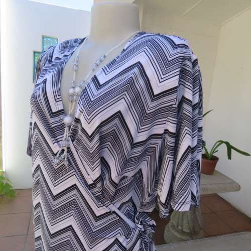 Stunning cross-over long white, black and grey top. By `Donna-Claire`. Size 44/20. New condition.