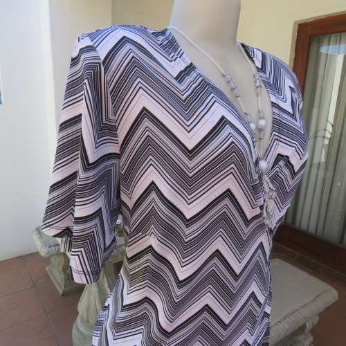 Stunning cross-over long white, black and grey top. By `Donna-Claire`. Size 44/20. New condition.
