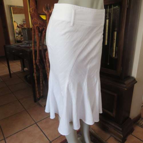 Charming white gored skirt with unique rounded panels. By `Identity` in size 34/10. As new.