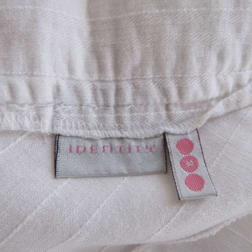Charming white gored skirt with unique rounded panels. By `Identity` in size 34/10. As new.
