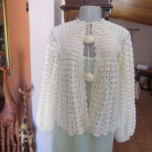 Feminine rich cream crochet bed jacket with long sleeves. Size 36/12 best fit. New condition.