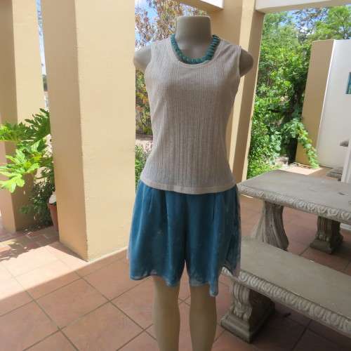 Chic white polyester/nylon blend opaque vest style top by DU FIRRE.Size 34/10. As new