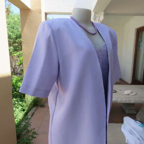As new open hanging boutique made polyester jacket in soft lilac colour.Short sleeves. Size 42/18.
