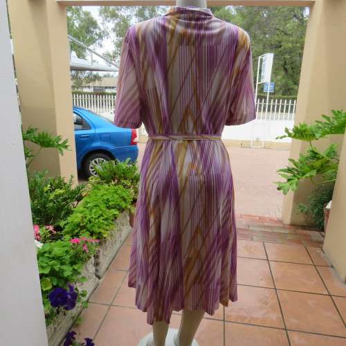 Beautiful vintage dress in white with lilac,mustard and beige lines. By JANE LANFORD size 50. As new