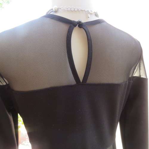 Cute little black bodycon dress with long sleeves in mini length. Size 32/8 by RT. New condition