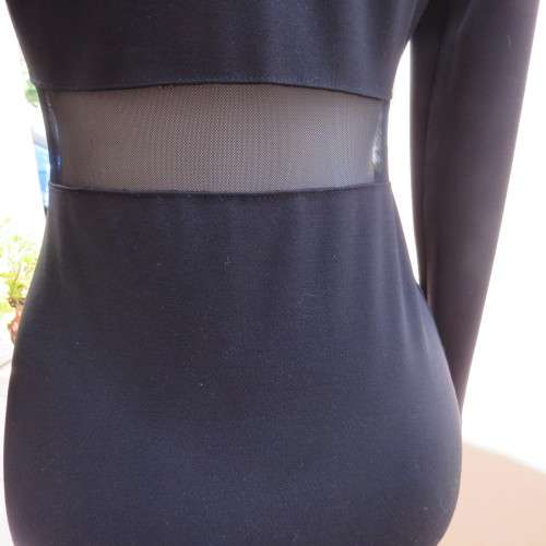 Cute little black bodycon dress with long sleeves in mini length. Size 32/8 by RT. New condition