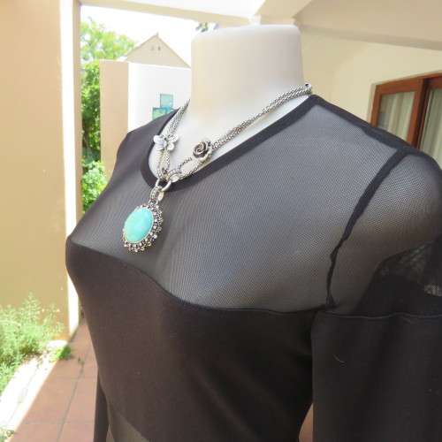 Cute little black bodycon dress with long sleeves in mini length. Size 32/8 by RT. New condition