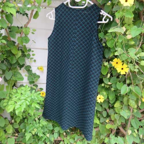 Slip over sleeveless dress in jade and black zig zag pattern. For girl 13 to 14 yrs old ,As new