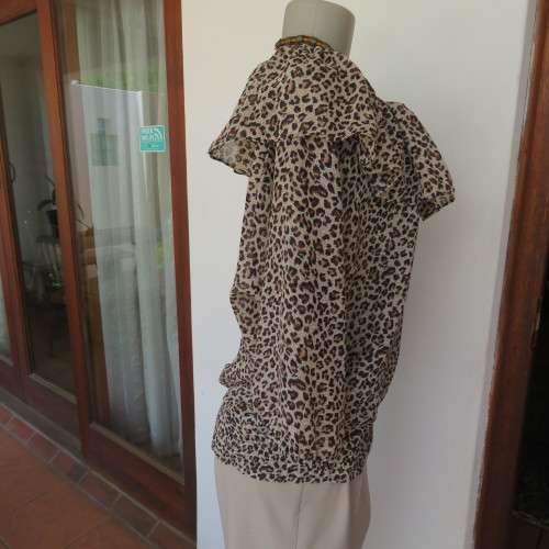 Pretty animal print slip over top in rich cream and brown sheer polyester.By EDGE size 42/18