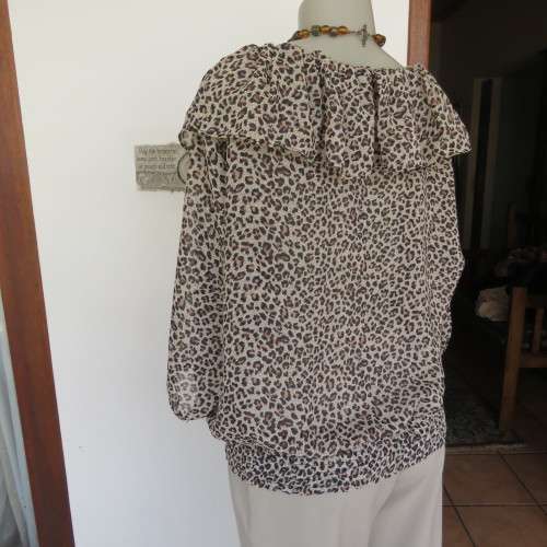 Pretty animal print slip over top in rich cream and brown sheer polyester.By EDGE size 42/18