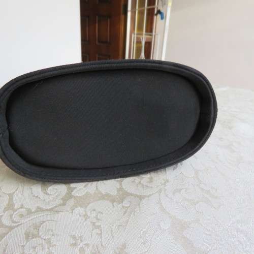 Small black bucket style handbag in shiny blocked vinyl .Size 18 x 16cm. As new