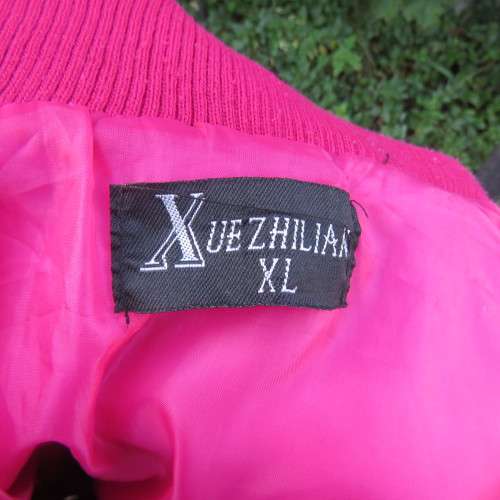 Warm magenta pink padded zip up waistcoat in size 36/12. Front pockets. Knitted ribbings.