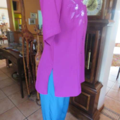 As new violet colour richly embroidered button down top size 38/14. Tailored with open collar.