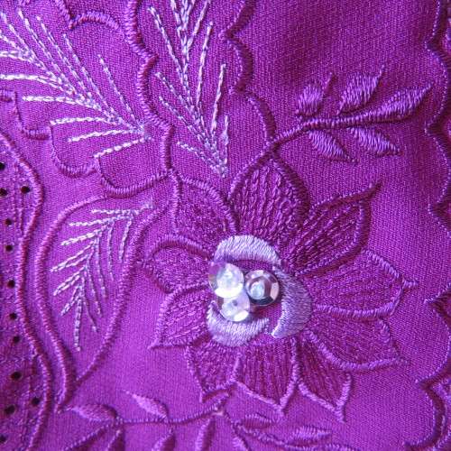 As new violet colour richly embroidered button down top size 38/14. Tailored with open collar.
