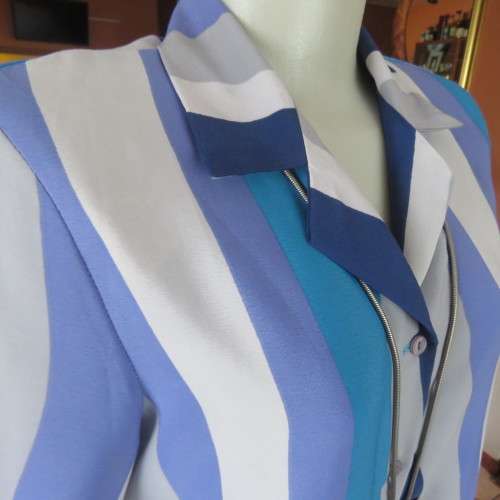 Pretty graphic patterned short sleeve top in blue,greys and lavender polyester. Size 36/12. As new