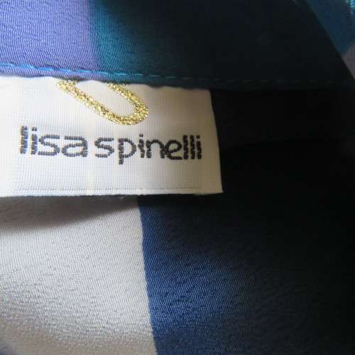 Pretty graphic patterned short sleeve top in blue,greys and lavender polyester. Size 36/12. As new