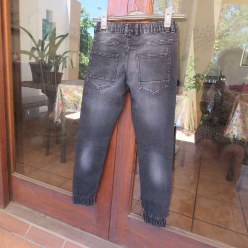 Black stretch polycotton jeans by (andUS) for 12 year old boy. Pockets front + back. As new.