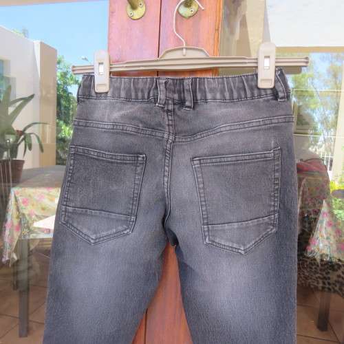 Black stretch polycotton jeans by (andUS) for 12 year old boy. Pockets front + back. As new.