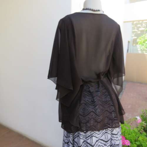 Black short sleeve open hanging glamour top with silver sparkles in diamond design size 34/10.