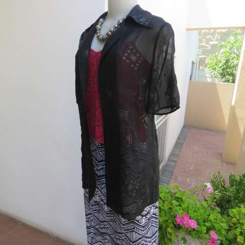 Black short sleeve open hanging glamour top with silver sparkles in diamond design size 34/10.