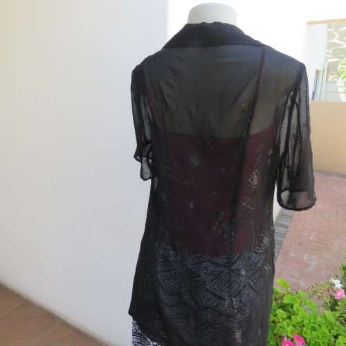 Black short sleeve open hanging glamour top with silver sparkles in diamond design size 34/10.