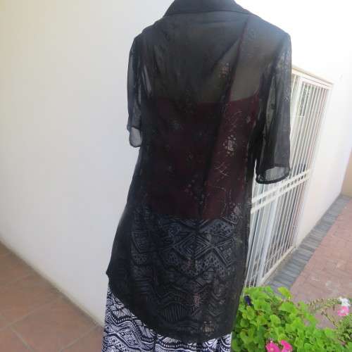 Black short sleeve open hanging glamour top with silver sparkles in diamond design size 34/10.