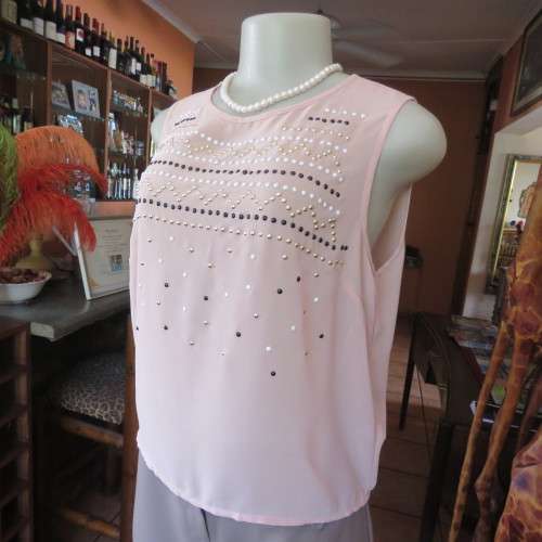 Chic little soft peach slip over cropped top by `ATMOSPHERE` in size 34/10. New condition.