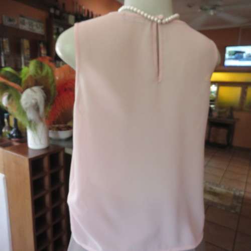 Chic little soft peach slip over cropped top by `ATMOSPHERE` in size 34/10. New condition.