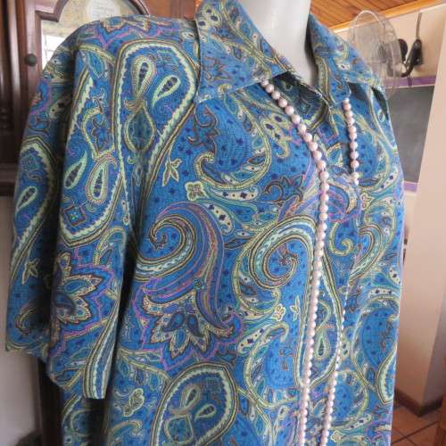 As new short sleeve top in blues, yellow, lilac and brown paisley designs. Size 46/22 by IMAGEMAKERS