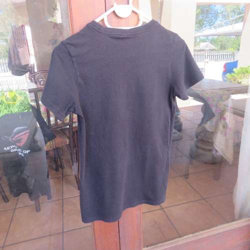 Black slim cut T-shirt for boy 13 to 14 years old boy by RT DYNAMIC EXPERIENCE logo. Good condition.