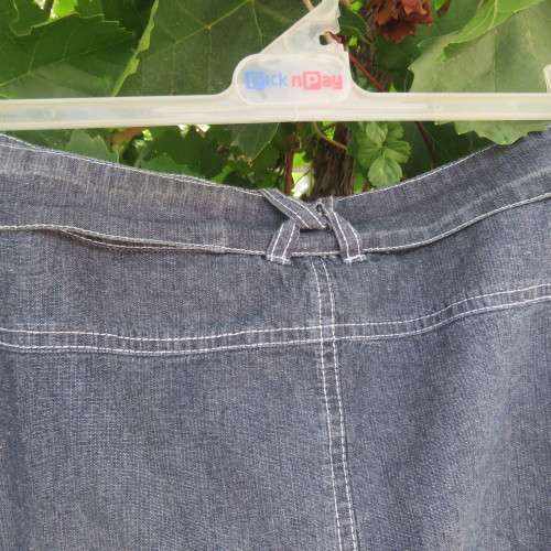 Denim skirt in bluegrey colour and white stitching by DONATELLA in size 44/20.