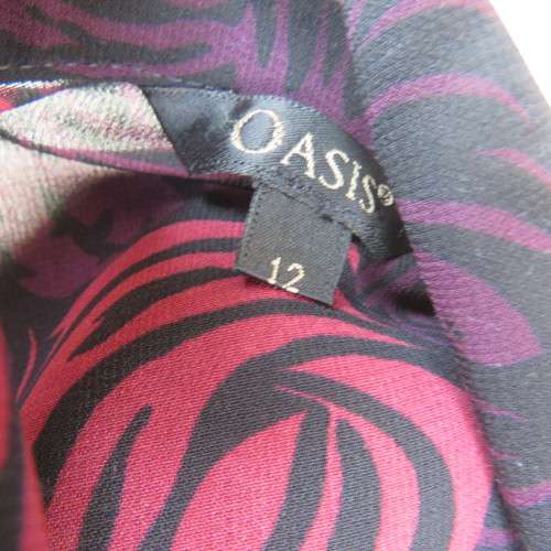 As new Fabulous black, purple and crimson floral patterned long sleeve top by OASIS size 36/12.