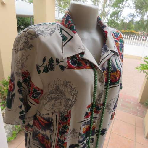 NOTICE ME short sleeve top with button down front. Size 48/24 by SOFT BLOUSE. In 100% polyester.