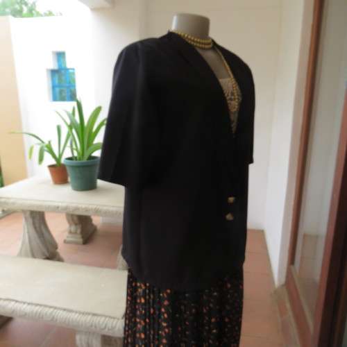 Smart black silky polyester short sleeve top/jacket with low shawl collar. Size 38/14 by DERMAR.