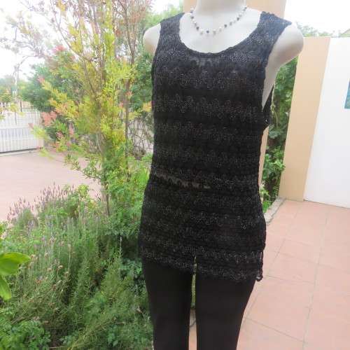Glamour sleeveless black and silver horizontal patterned see-through top. Lined to waist. Size 34