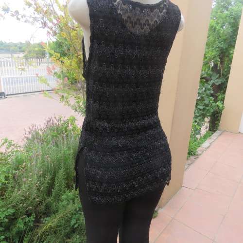 Glamour sleeveless black and silver horizontal patterned see-through top. Lined to waist. Size 34