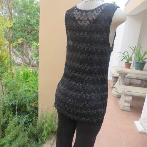 Glamour sleeveless black and silver horizontal patterned see-through top. Lined to waist. Size 34