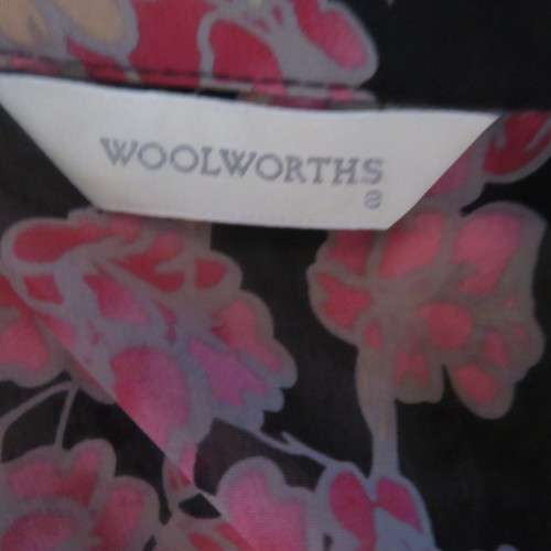 Fabulous black sheer polyester top with pink/cream posies.Size 32/8 by WOOLWORTHS.As new.