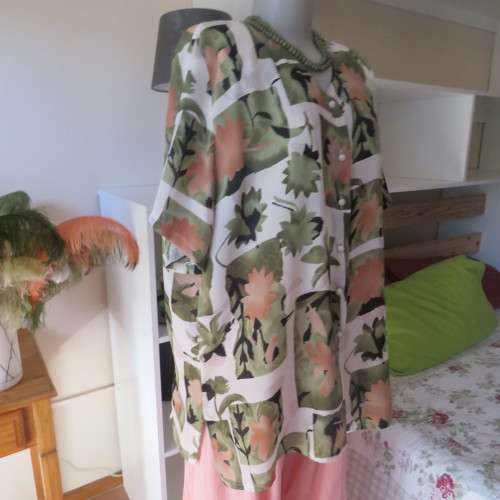 Pattern blocked cream top with green and peach flowers.Collarless with V. Size 42/18 by CHARLOTTE