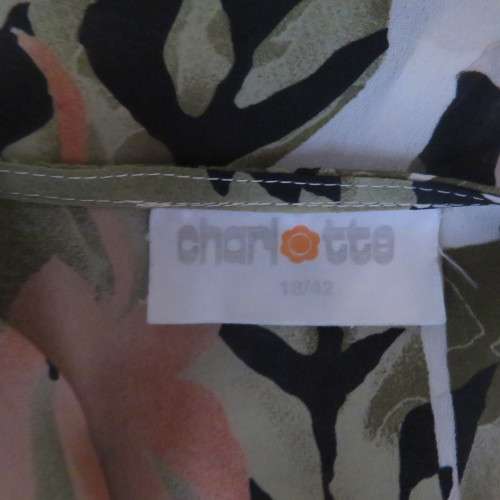 Pattern blocked cream top with green and peach flowers.Collarless with V. Size 42/18 by CHARLOTTE