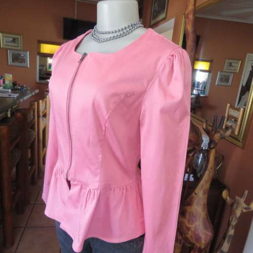 Peplum zip-up long sleeve stretch cotton top in salmon pink. Size 34 loose. 36 tight. By RT.As new