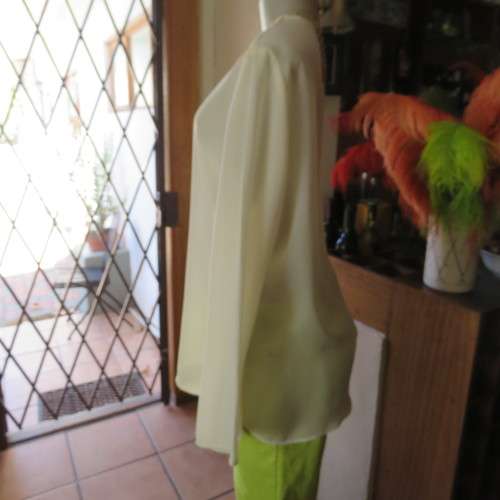 Stylish rich cream slip over long sleeve top size 38/14 with pretty embroidered neckline.By STATURE.