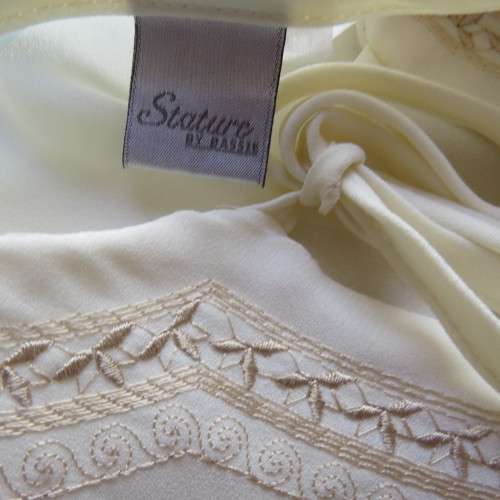 Stylish rich cream slip over long sleeve top size 38/14 with pretty embroidered neckline.By STATURE.