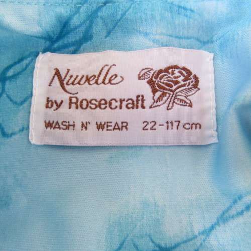 As new 80`s NUWELLE by Rosecraft vintage short sleeve dress in graphic jade blue colours.Size 46/22.