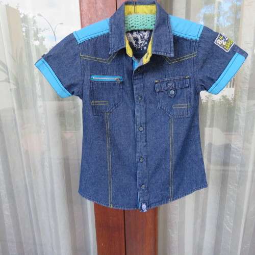 Handsome little short sleeve denim shirt for 5 to 6 yr old boy.Chest 66cm. 2 front pockets.As New