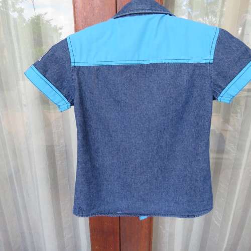 Handsome little short sleeve denim shirt for 5 to 6 yr old boy.Chest 66cm. 2 front pockets.As New