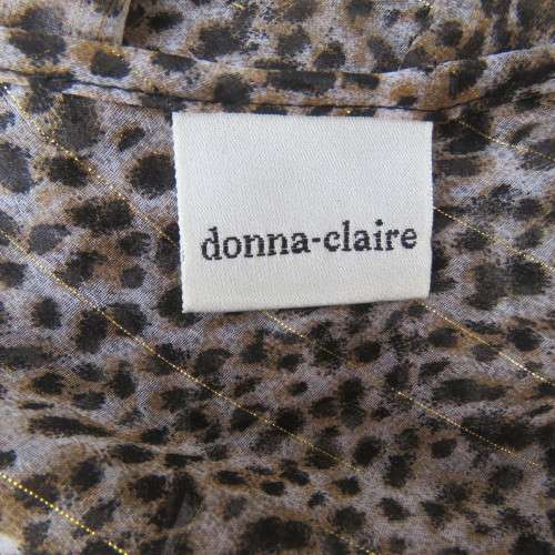 DONNA CLAIRE slip me over long animal print V neck top with elbow length sleeves. Size 44/20