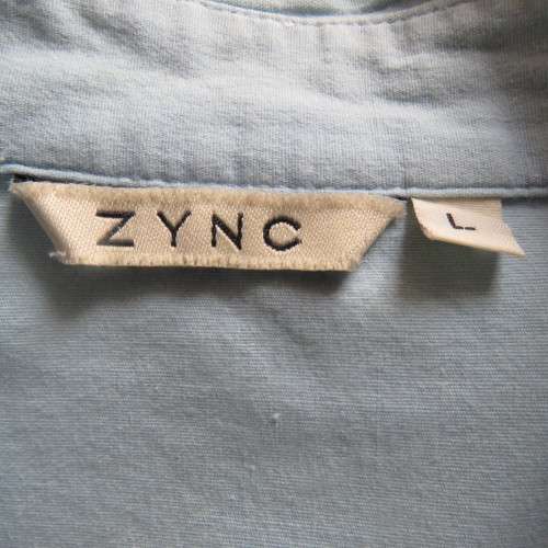 High quality long sleeve light blue used shirt by ZINC from London. Size 34. In stretch cotton.
