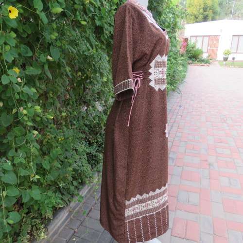 Unique ethnic low calf length dress in mottled brown/cream richly embellished. Size 34 to 36.As new